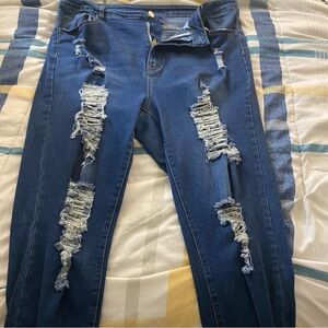 medium wash ripped blue jeans